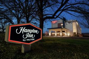 a sign for a hampton inn in front of a building at Hampton Inn Portland Airport in Portland