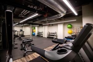 a gym with a bunch of cardio equipment in it at Motto by Hilton Philadelphia Rittenhouse Square in Philadelphia