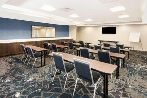 a conference room with tables and chairs and a screen at Hampton Inn Kennebunk Kennebunkport Me in Kennebunk +35 photos