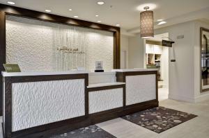 a lobby with a counter in a store at Hilton Garden Inn Detroit Troy in Troy +28 photos