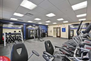 a gym with a bunch of cardio equipment in it at Hampton Inn Livonia Detroit in Livonia