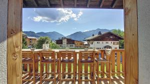 a group of chairs on a porch with a view at la ranche in Montriond