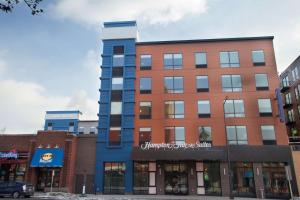 a building on a city street with buildings at Hampton Inn & Suites St. Paul Downtown in Saint Paul