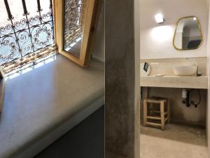 a bathroom with a sink and a window at Dar Oki in Marrakesh