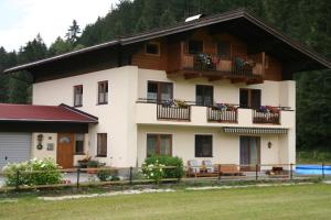 a house with two balconies on the side of it at Oase der Ruhe in Hollersbach im Pinzgau