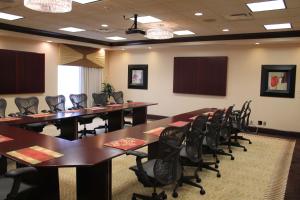 a conference room with tables and chairs in it at Hilton Garden Inn Cincinnati Blue Ash in Blue Ash +21 photos