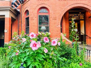 a house with a bunch of flowers in front of it at Copley House in Boston