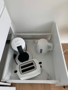 a drawer with a kitchen appliance in it at Skammidalur cottages in Vík