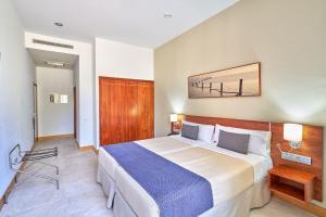a bedroom with a large bed in a room at Hotel Torre Del Conde in San Sebastián de la Gomera