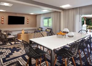 a meeting room with a table and chairs at Hilton Santa Cruz Scotts Valley in Santa Cruz