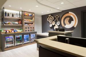 a restaurant with a counter and some refrigerators at Hilton Santa Cruz Scotts Valley in Santa Cruz