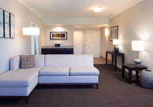 a living room with a couch and a table at Hilton Santa Cruz Scotts Valley in Santa Cruz