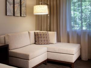 a living room with a couch and a window at Hilton Santa Cruz Scotts Valley in Santa Cruz