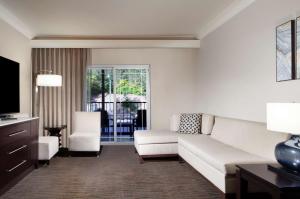 a living room with a couch and a table at Hilton Santa Cruz Scotts Valley in Santa Cruz