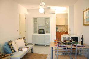 a living room with a couch and a table at Guest House - La Sirena Salentina in Patù