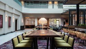 a dining room with a table and chairs at Embassy Suites by Hilton Walnut Creek in Walnut Creek