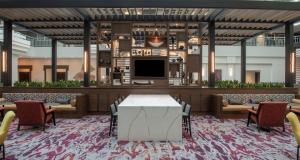 a rendering of a lobby with a table and chairs at Embassy Suites by Hilton Walnut Creek in Walnut Creek