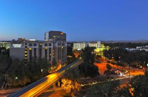 a view of a city at night with a highway at Embassy Suites by Hilton Walnut Creek in Walnut Creek