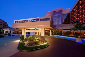 a large building with a courtyard in front of it at Hilton Orange County/Costa Mesa in Costa Mesa