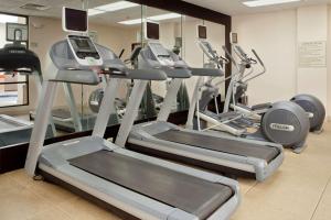 a gym with treadmills and elliptical machines at DoubleTree by Hilton Columbus/Worthington in Worthington