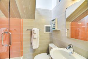 a bathroom with a sink and a toilet and a shower at Luxe Boulder Barrett House on Mtn Peak with Hot Tub in Boulder