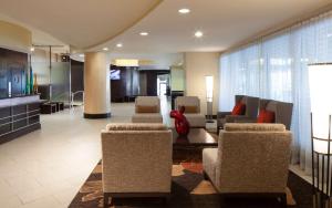 a lobby with couches and chairs in a building at DoubleTree by Hilton El Paso Downtown in El Paso