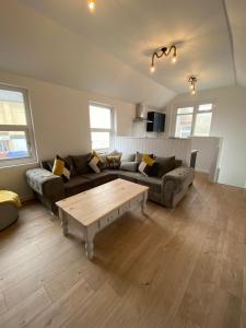 a living room with a couch and a coffee table at The Old Warehouse in Blackpool