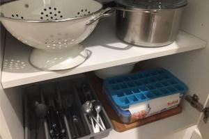 a kitchen shelf with a mixer and some utensils at Studio Duquesne - Parc tête d'Or-métro Foch in Lyon