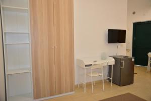 Televízia a/alebo spoločenská miestnosť v ubytovaní Residence Airone