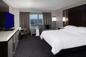 a hotel room with a bed and a television at Hilton Boston Back Bay in Boston