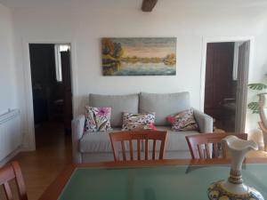 a living room with a couch and two chairs at O Noso Lar - RIBEIRA SACRA in Nogueira de Ramuin
