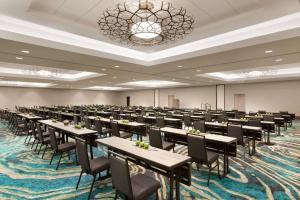 a large room with tables and chairs in it at Embassy Suites By Hilton Boulder in Boulder