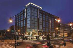 a tall building in a city at night at Homewood Suites by Hilton Washington DC Capitol-Navy Yard in Washington