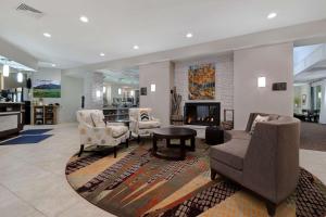 a living room with furniture and a fireplace at Homewood Suites by Hilton Boulder in Boulder