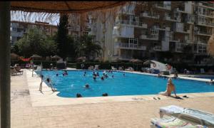 a group of people in a swimming pool at Iris in Benalmádena