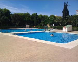 a group of people in a swimming pool at Iris in Benalmádena