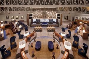 an overhead view of a conference room with a large table and chairs at Hilton Nashville Airport in Nashville