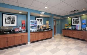 a fast food restaurant with two checkout counters in a room at Hampton Inn & Suites Moline-Quad City Int'l Aprt in Moline