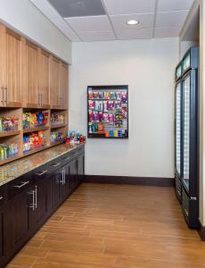 a pharmacy room with wooden cabinets and a display at Homewood Suites by Hilton San Bernardino in San Bernardino