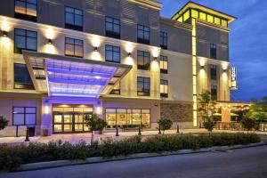 an exterior view of a building at night at Home2 Suites by Hilton Perrysburg Levis Commons Toledo in Perrysburg