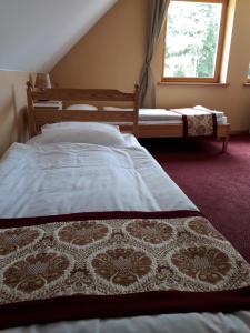 a bedroom with a bed and a window at Viki talu in Jõõpre +8 photos