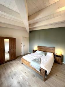 En eller flere senge i et værelse på Appartamento Ginepro