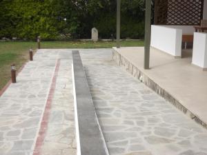 a concrete walkway in a park at Istira in Possidi