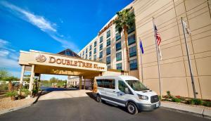 a white van parked in front of a hotel at DoubleTree by Hilton Las Vegas Airport in Las Vegas