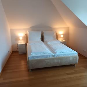 Postel nebo postele na pokoji v ubytování Dünenhaus Zimmer