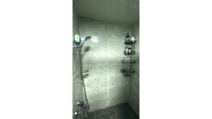 a bathroom with a shower with a glass door at Newly Refurbished 2 Bedroom Apartment in the Heart of Istanbul in Istanbul