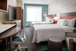 Home2 Suites By Hilton Denver Downtown Convention Center客房内的一张或多张床位