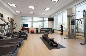 a gym with treadmills and machines in a room at Hilton Garden Inn Denver/Cherry Creek in Denver