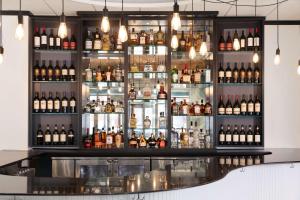 a bar with a lot of bottles of alcohol at Onyx Boston Downtown in Boston