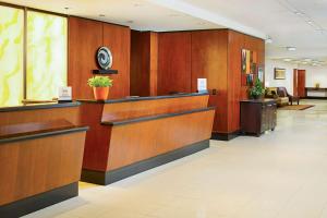 a lobby with wood paneling and a waiting area at Hilton Providence in Providence